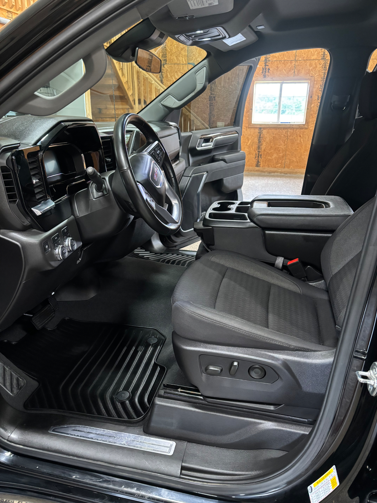 The same GMC interior after a full detail — clean mats, dressed panels