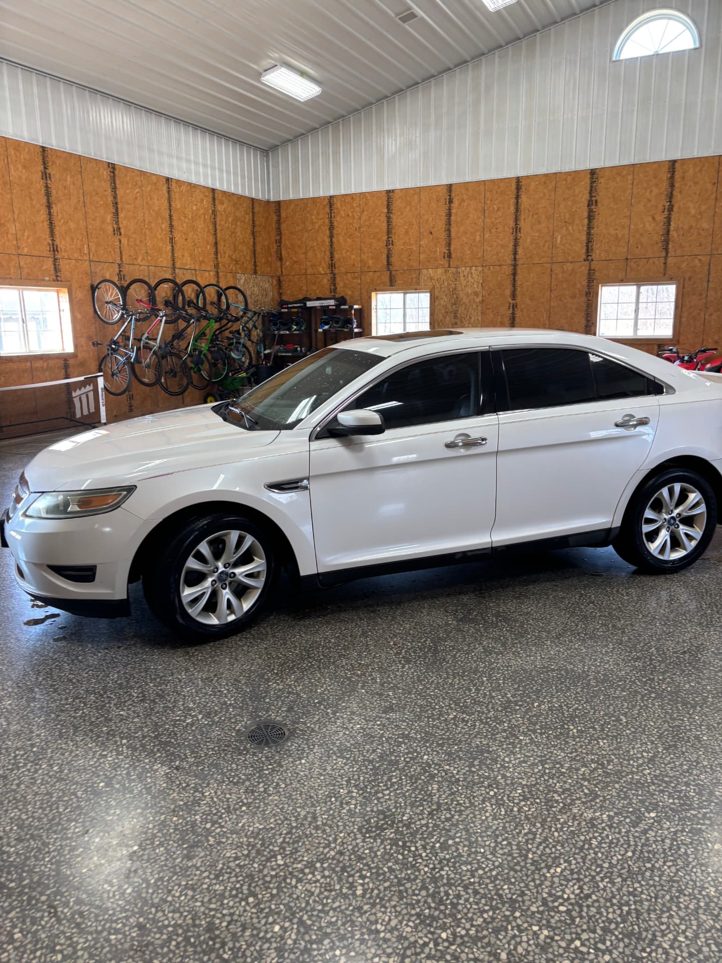 White Ford Taurus after a complete wash and detail
