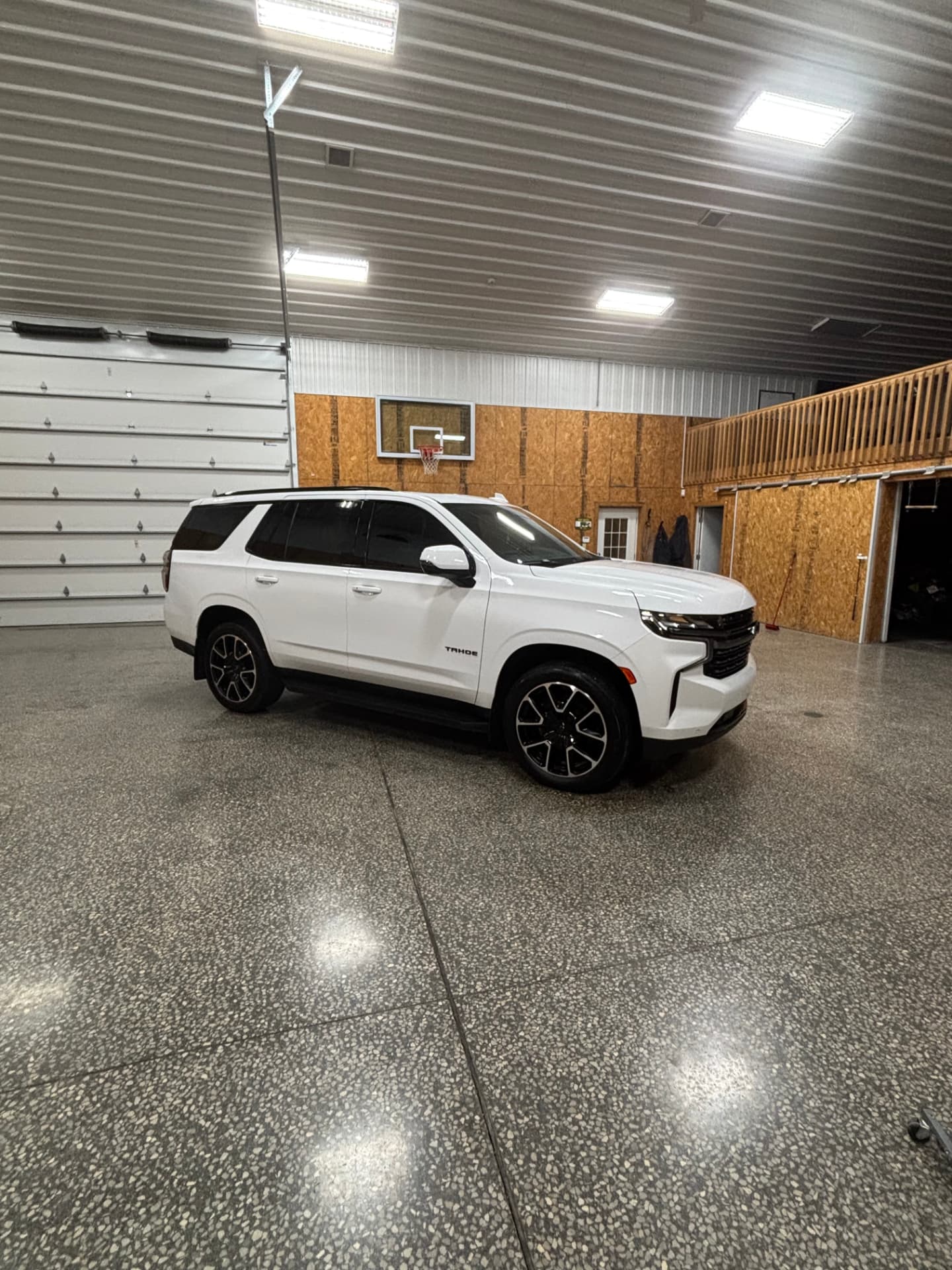 White Chevrolet Tahoe with a glossy finish after a full exterior detail